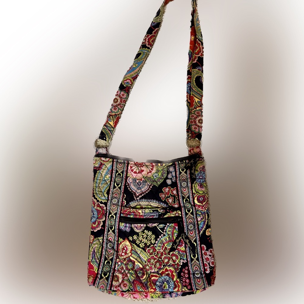 Vera Bradley.  crossbody purse/features separate zippered compartment on side.